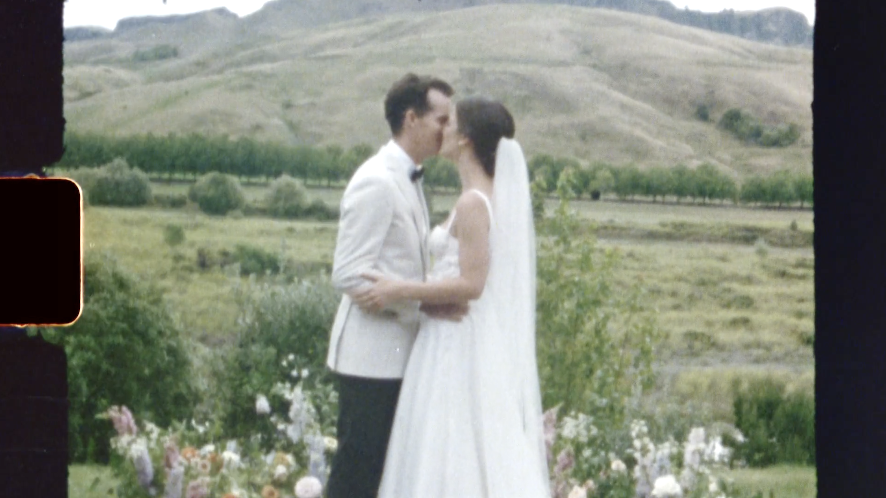 Still frame from super 8 bride and groom ceremony first kiss Ana Galloway Photography