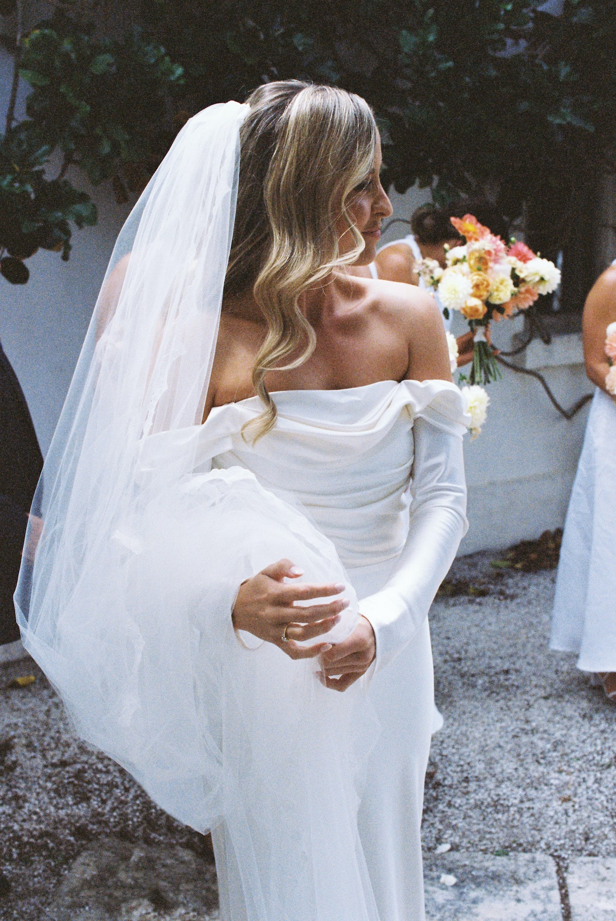 A stunning photo showcasing the bride's wedding dress, with intricate details and delicate fabrics adding to the overall beauty of the image. Ana Galloway Photography