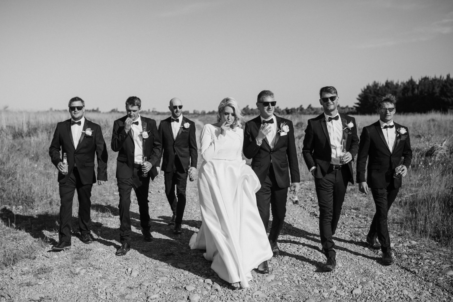 Bride and Groom with the groomsmen walking in the mountain Ana Galloway Photography