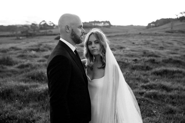 bride and groom enjoying the sun setting behind them and cold breeze passing by Ana Galloway Photography