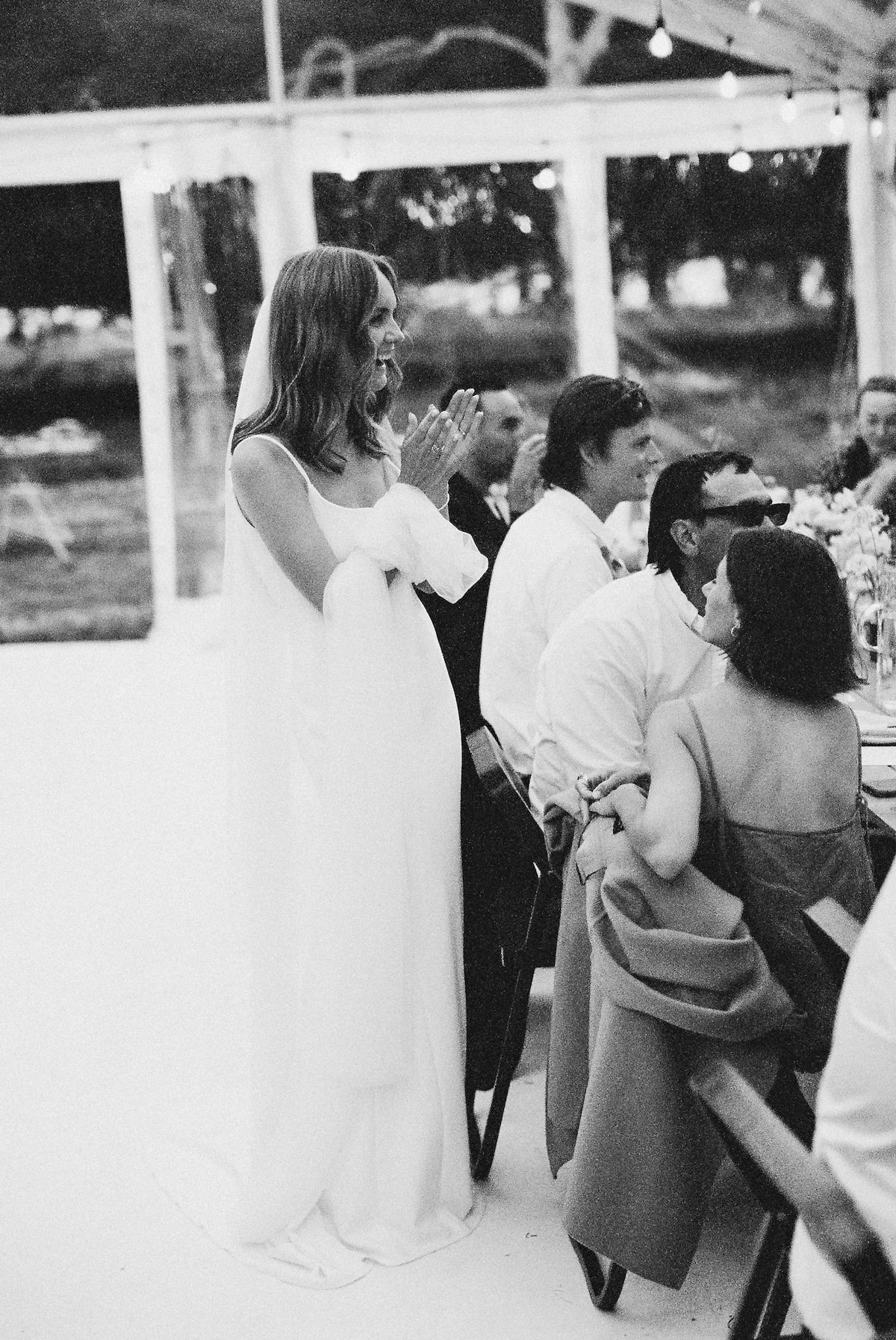 bride enjoying her wedding reception and celebrated with friends and family film photo. Ana Galloway Photography