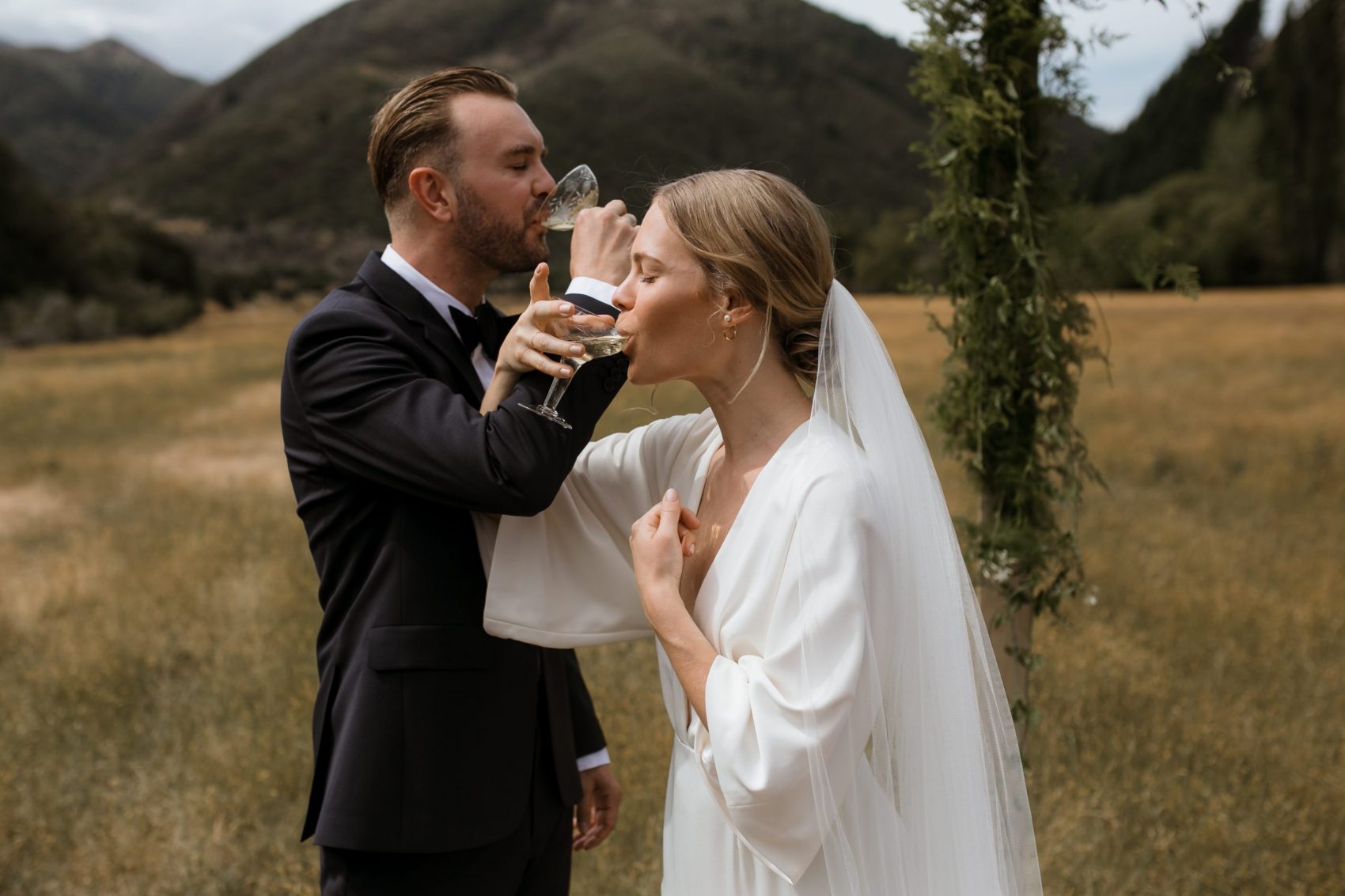 Bride and groom drinking champagne together after the ceremony Nelson Wedding Ana Galloway Photography