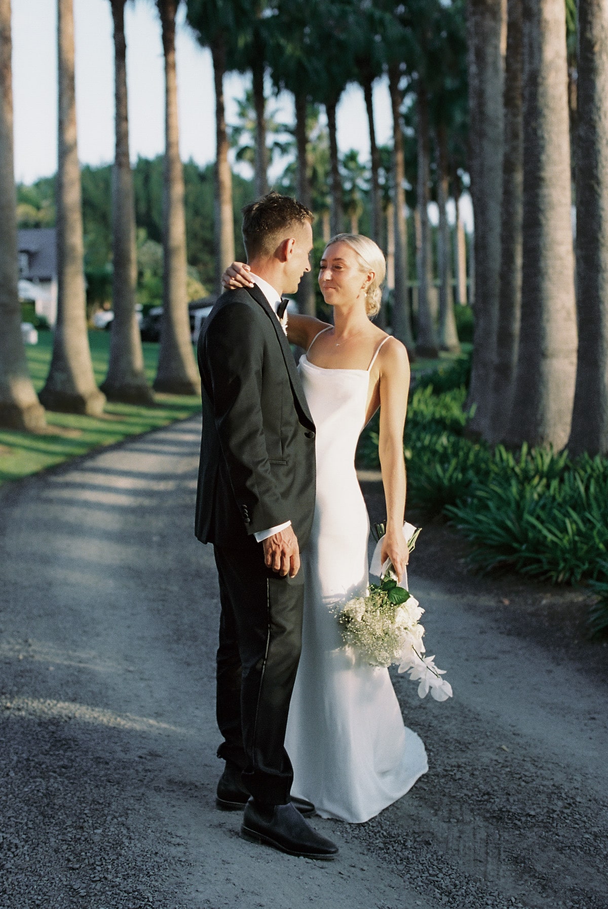 bride and groom standing lovingly gazing at each other film photo Ana Galloway Photography