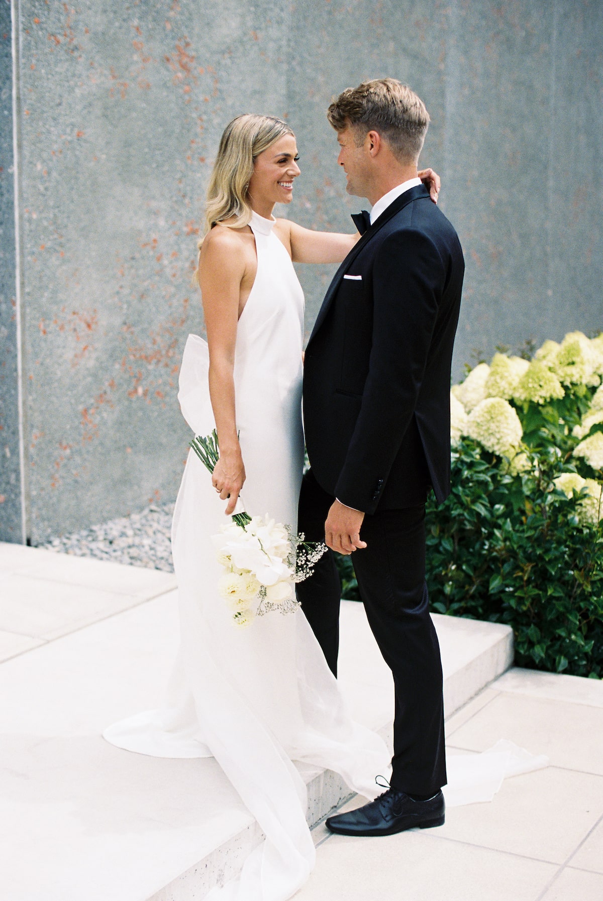 A heartwarming photo capturing the moment the couple first saw each other on their wedding day, with love and emotions on full display. Ana Galloway Photography