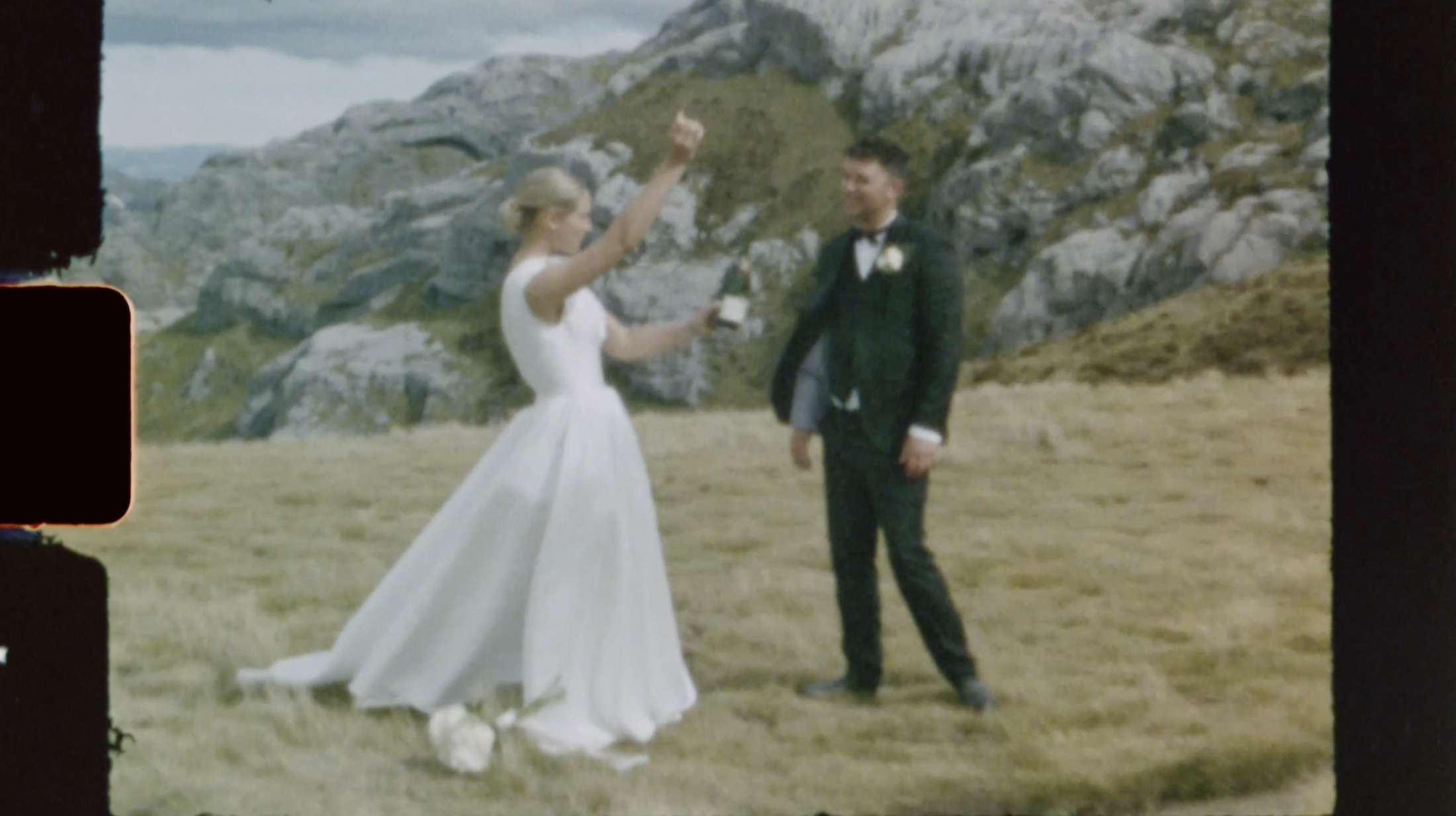 Bride and groom celebrating with champagne on the Mount Owen, image shot on Super 8 film. Nelson Wedding Ana Galloway Photography