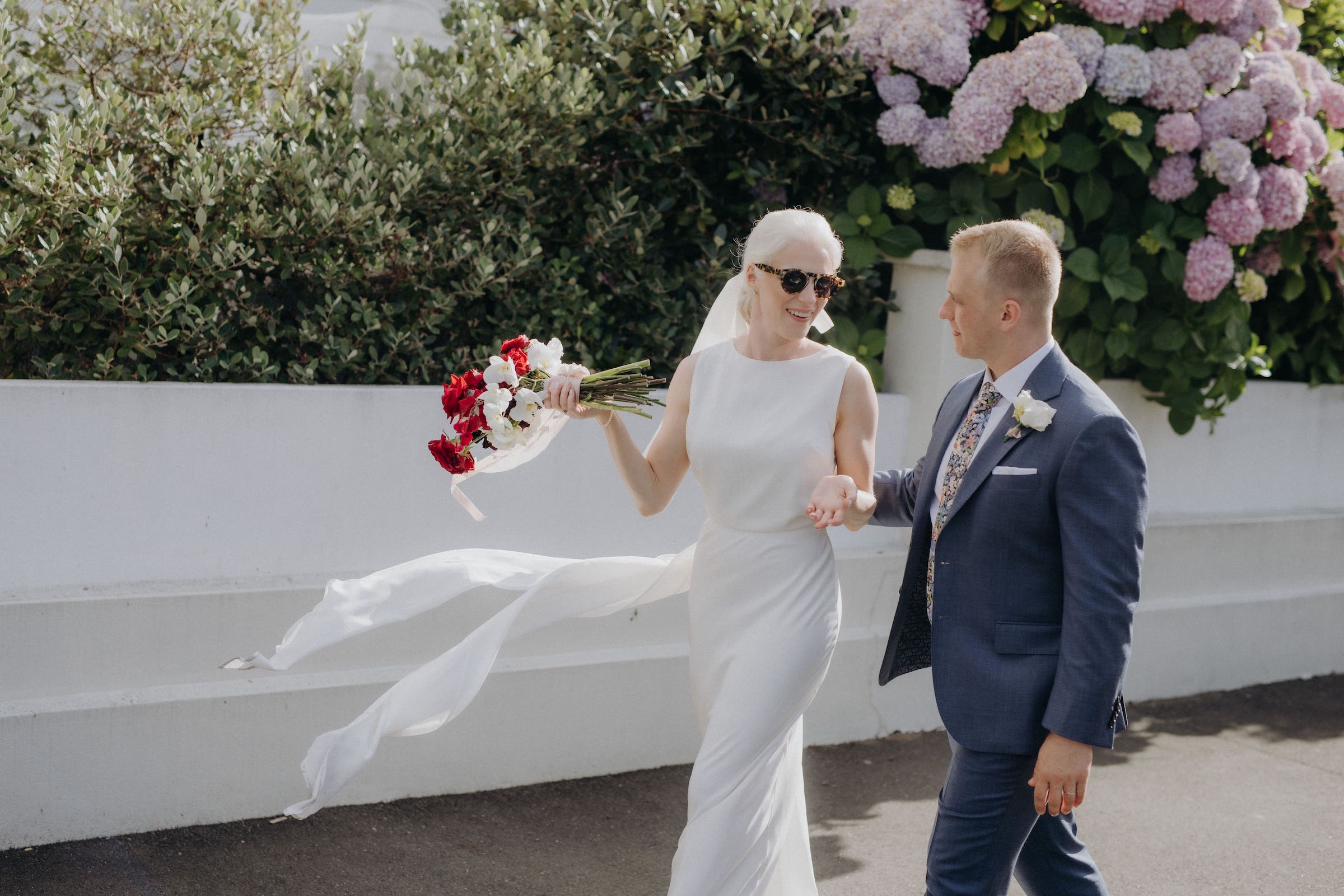 Stylish bride and groom casually walking along the street Nelson Wedding Ana Galloway Photography