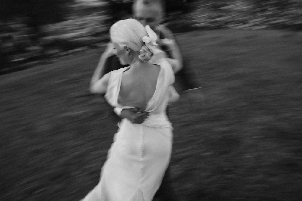 Stylish bride and groom romantically dancing together in the evening light Nelson Wedding Ana Galloway Photography