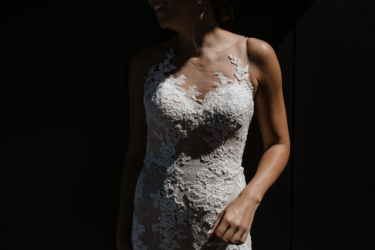 Modern Bridal Dress with its beautiful floral lace details on her dress Ana Galloway Photography