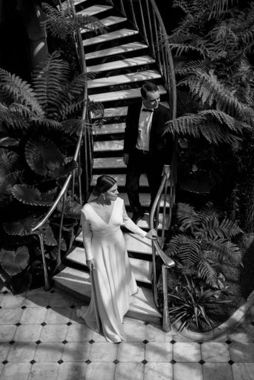 Bride and groom on staircase Modern Classic Christchurch New Zealand Wedding